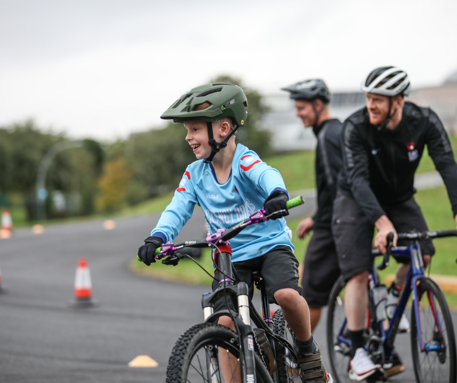 Grinning faces, having fun on bikes.